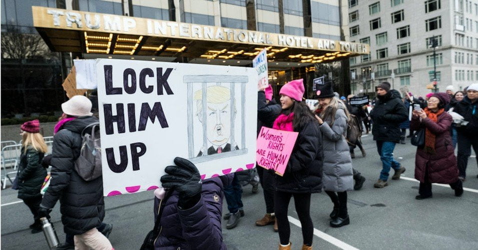 Protesters with a placard demanding the jailing of President Donald Trump during the Women's March in Manhattan on January 18, 2020. (Photo: Ira L. Black/Corbis/Getty Images)
