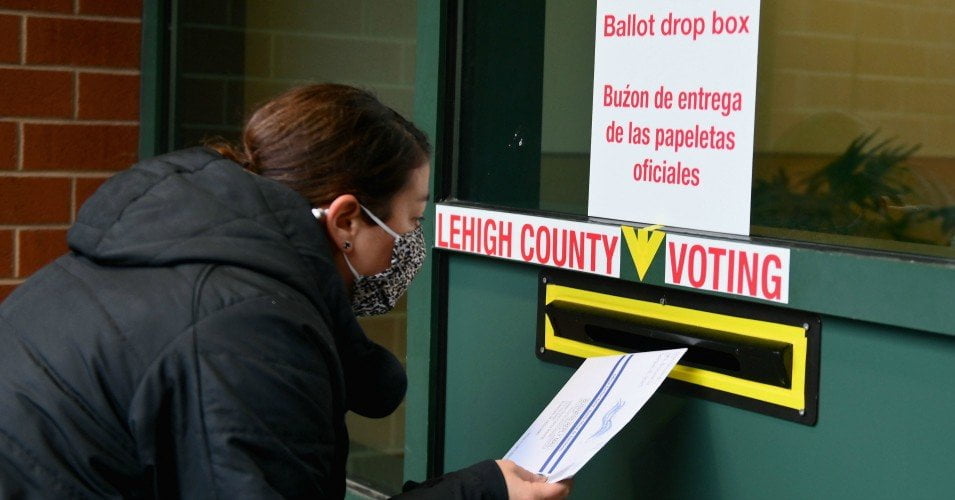 A voter arrives to drop off he ballot during early voting in Allentown, Pennsylvania on October 29, 2020.