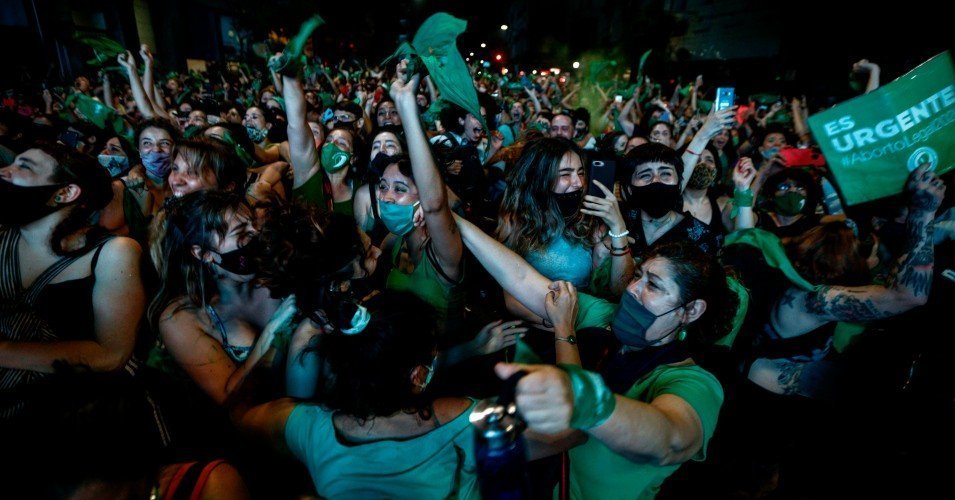 Pro-choice activists celebrate in Buenos Aires after Argentina's Senate approved a bill to legalize abortion on December 30, 2020.