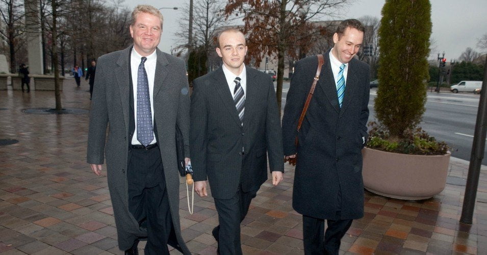 Former Blackwater security guard Nick Slatten and his lawyer Thomas Connolly leave an arraignment hearing at U.S. district court on January 6, 2009 in Washington, D.C.