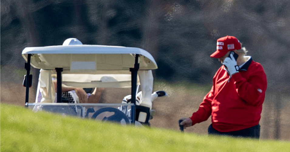 President Donald Trump makes a phone call as he golfs at Trump National Golf Club on November 26, 2020 in Sterling, Virginia.